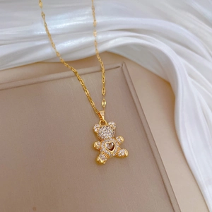 Gold-plated teddy bear necklace with heart cutout and micro-set cubic zirconia stones