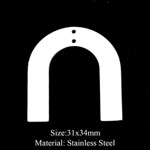 Macro detail of arched stainless steel jewelry pendant measuring 31x34mm for DIY