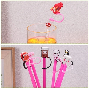 Detail of pink silicone nurse-themed toppers for drinking straws in various medical shapes