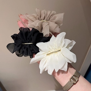 Elegant chiffon flower hair clips in beige, black, and white colors with gold accents