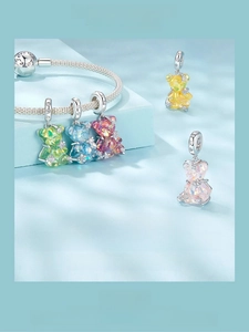Detailed view of 925 sterling silver colorful bear charms with sparkling zircon stone accents