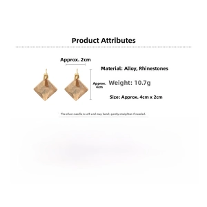 Rhombic clip-on earrings with amber gems and rhinestones showing 4cm by 2cm dimensions