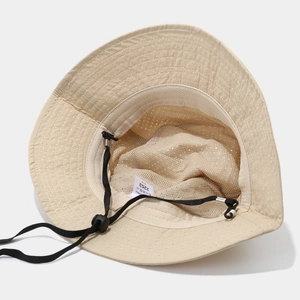 Breathable beige outdoor sun hat with wide mesh lining and adjustable chin strap