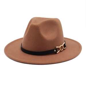 Brown wide brim fedora hat with leather band and gold chain accent on white background