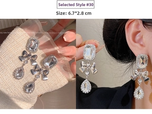 Detail of silver long bow tassel earrings with crystals and real wearing size 6.7x2.8cm