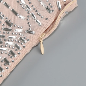 Macro shot of invisible zipper and luxury rhinestones on a mesh fish tail dress