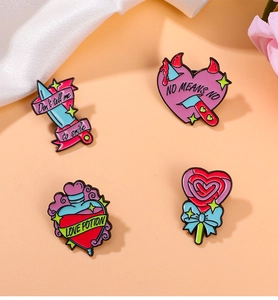 Detailed view of four colorful enamel lapel pins with unique cartoon and slogan designs