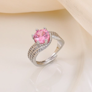 Macro view of a 3-carat pink zircon ring with triple-row twisted pave setting