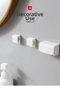 Detail of white wall-mounted toothbrush holders and storage box for bathroom