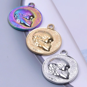Detailed relief of skull charms in rainbow, gold, and silver finishes for DIY jewelry