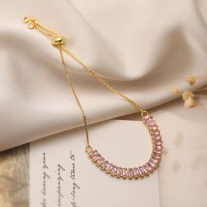 Detail of pink zircon gold-plated bracelet with adjustable sliding buckle and box chain