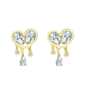 Detail of gold heart earrings with melting water drop fringe and sparkling clear zircon