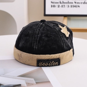 Retro vintage washed denim docker cap with khaki trim and star patch in classic black
