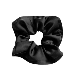Elegant black satin scrunchie with ruffled edges for women's hairstyle fashion accessory