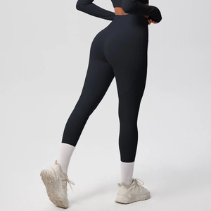 Detail view of high-waist yoga leggings showing butt-lifting effect and matte texture
