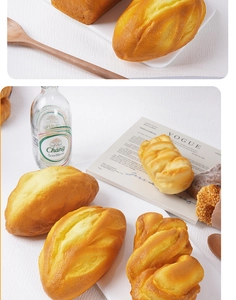 Realistic PU slow-rebound artificial bread models displayed on a rustic white wood board
