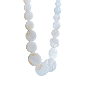 Minimalist white round seashell disc necklace with iridescent mother of pearl shimmer