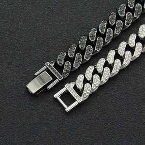 Iced out Cuban link bracelet in silver tone featuring sparkling white and dark rhinestones