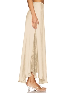 Detail of champagne satin midi skirt showing elegant side lace patchwork and silky texture