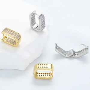 Luxurious gold and silver huggie earrings with micro-pave cubic zirconia stones