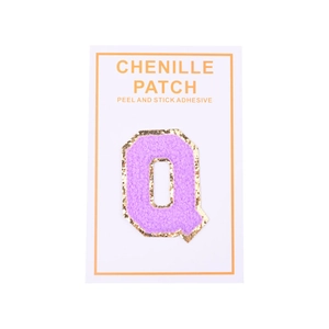 Detailed view of purple chenille letter Q patch with gold glitter borders and adhesive backing
