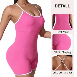 Pink ribbed yoga bodysuit with white contrast trim and cross-back straps for fitness