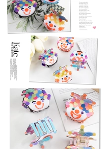 Detailed view of colorful clown PVC hair claw clips in various stylish color schemes
