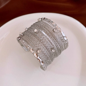 Macro shot of silver multi-layer wire cuff bracelet with sparkling crystal rhinestones