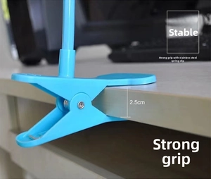 Blaue Federklemme für Handyhalter mit einer maximalen Öffnungsbreite von 2.5 cm am Tisch