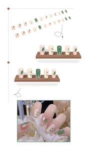 Detail view of medium coffin press-on nails in matcha green, milky white, and pink glitter