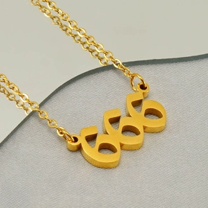 Polished gold stainless steel necklace featuring a minimalist 666 Arabic numeral pendant