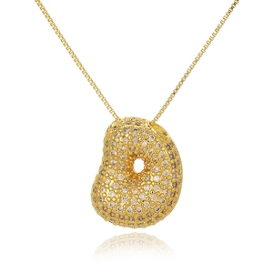 Macro shot of gold-plated bean pendant necklace with white zircon pavé setting