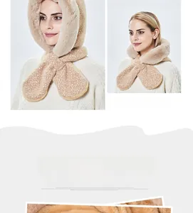 Detail of plush winter hooded scarf with white reindeer spots in apricot yellow