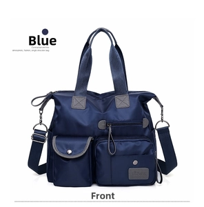 Deep blue multi-pocket nylon tote bag with adjustable shoulder strap and durable handles