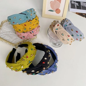 Close-up of assorted baroque knot headbands with colorful rhinestones in various colors