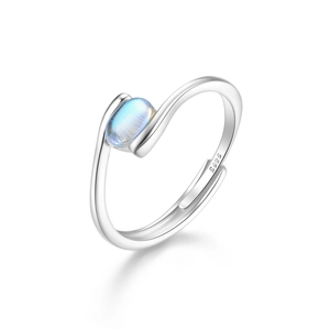 Macro detail of S925 sterling silver bypass ring featuring an oval moonstone and S925 stamp