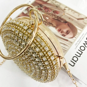 Luxury round rhinestone evening clutch bag with gold circular metal ring handles and chain