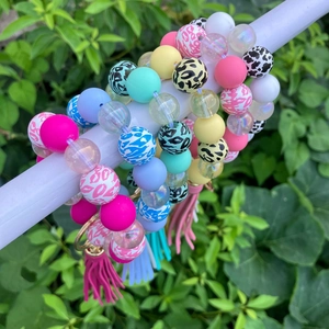 Colorful silicone leopard print beaded wristlet keychain with leather tassel details