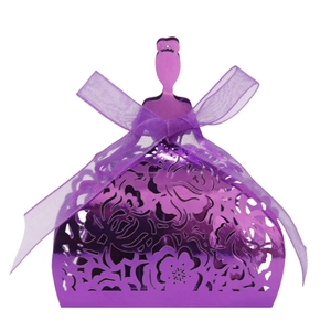 Detail of purple hollow princess candy box with intricate cutouts and a ribbon bow