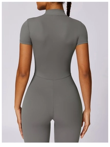 Rear view of a tight grey short sleeve bodysuit showing ergonomic back seam detail