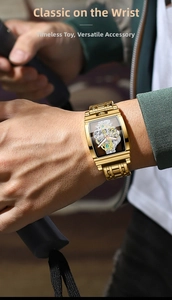 Close-up of golden tonneau skeleton watch on wrist showing intricate gears and mechanical movement