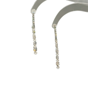 Elegant long silver tassel earrings featuring sparkling zircons and white pearls on white background