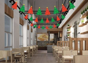 Detail of red and green paper Christmas tree bunting hanging in a modern dining room setting