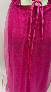 Detail of rose red mesh fabric with glitter sequins and matching tie string decoration