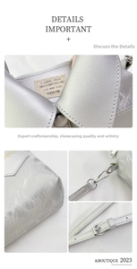 Macro detail of silver iridescent crossbody bag showing metal hooks and casual pouch label