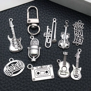 Antique silver musical instrument charms set including guitars, microphone and music notes