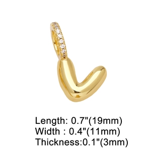 Macro shot of gold-plated V-letter pendant with zircon inlay and product size details
