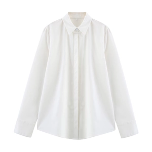 Detailed flat lay of white long-sleeve linen shirt with hidden buttons and classic collar
