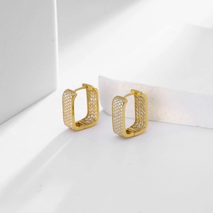Detail view of gold square hoop earrings featuring micro-pave white zircon stones