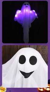 Close-up of glowing Halloween ghost hanging decor with LED lights and smiling face
